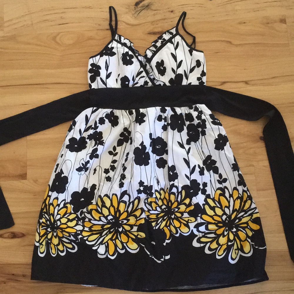 Black and White sun dress with yellow flowers.